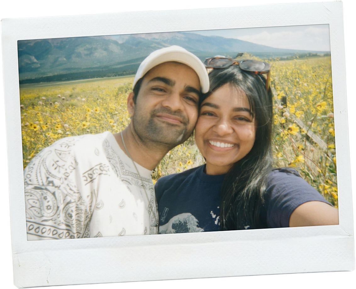 Akriti and Srijan in a field of sunflowers